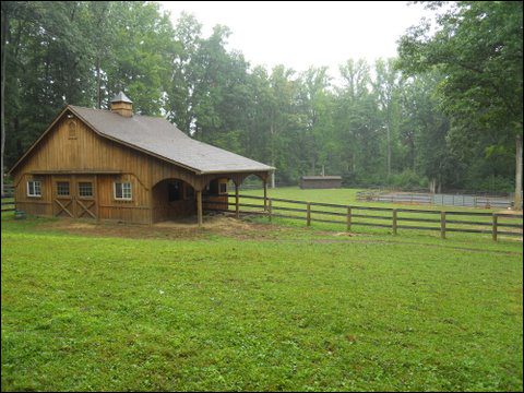 Country barn with fenced pasture